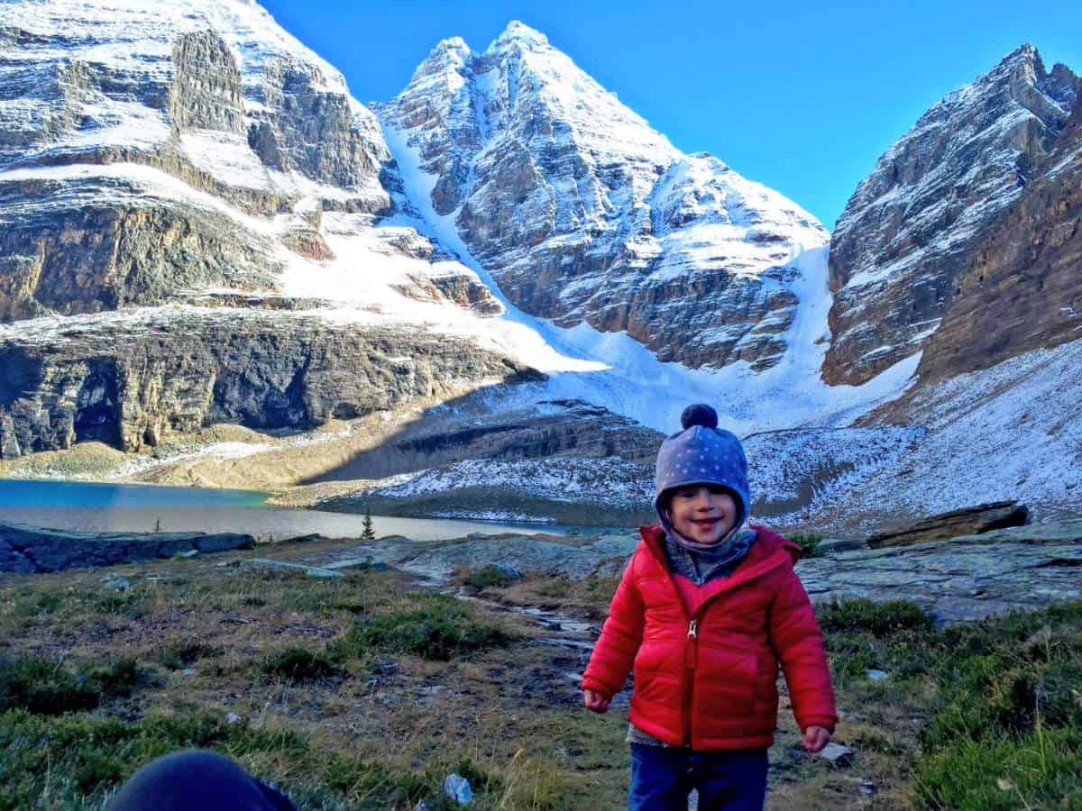 What to pack - Little girl wearing warm clothes on a hike in Yoho National Park, Canada