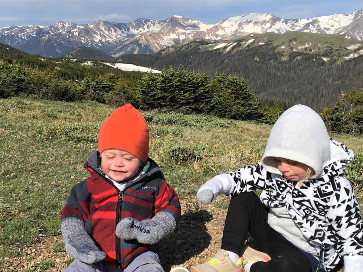 What to pack - Kids wearing extra socks as gloves on hike in Rocky Mountain National Park, Colorado