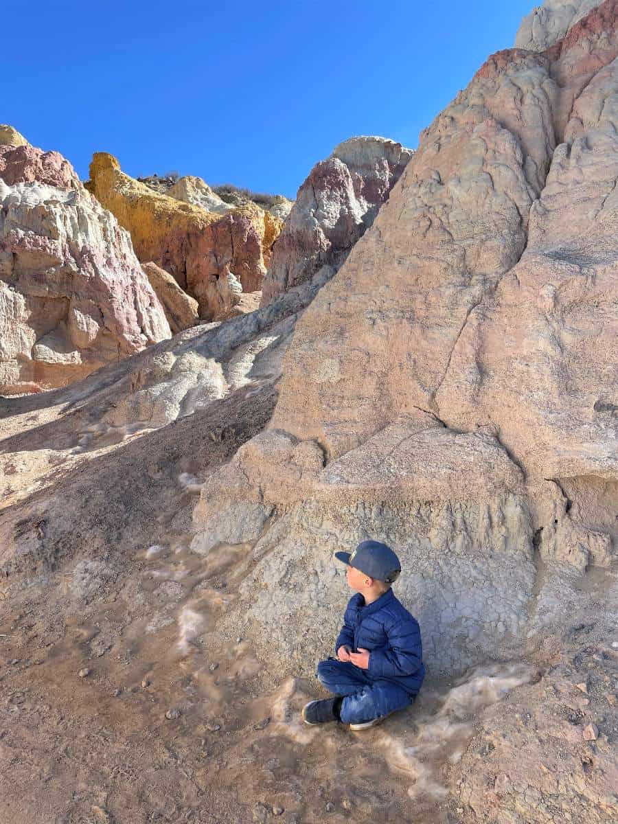 Boy sitting at Paint Mines hikes