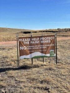 Sign reads Please Help Protect Paint Mines