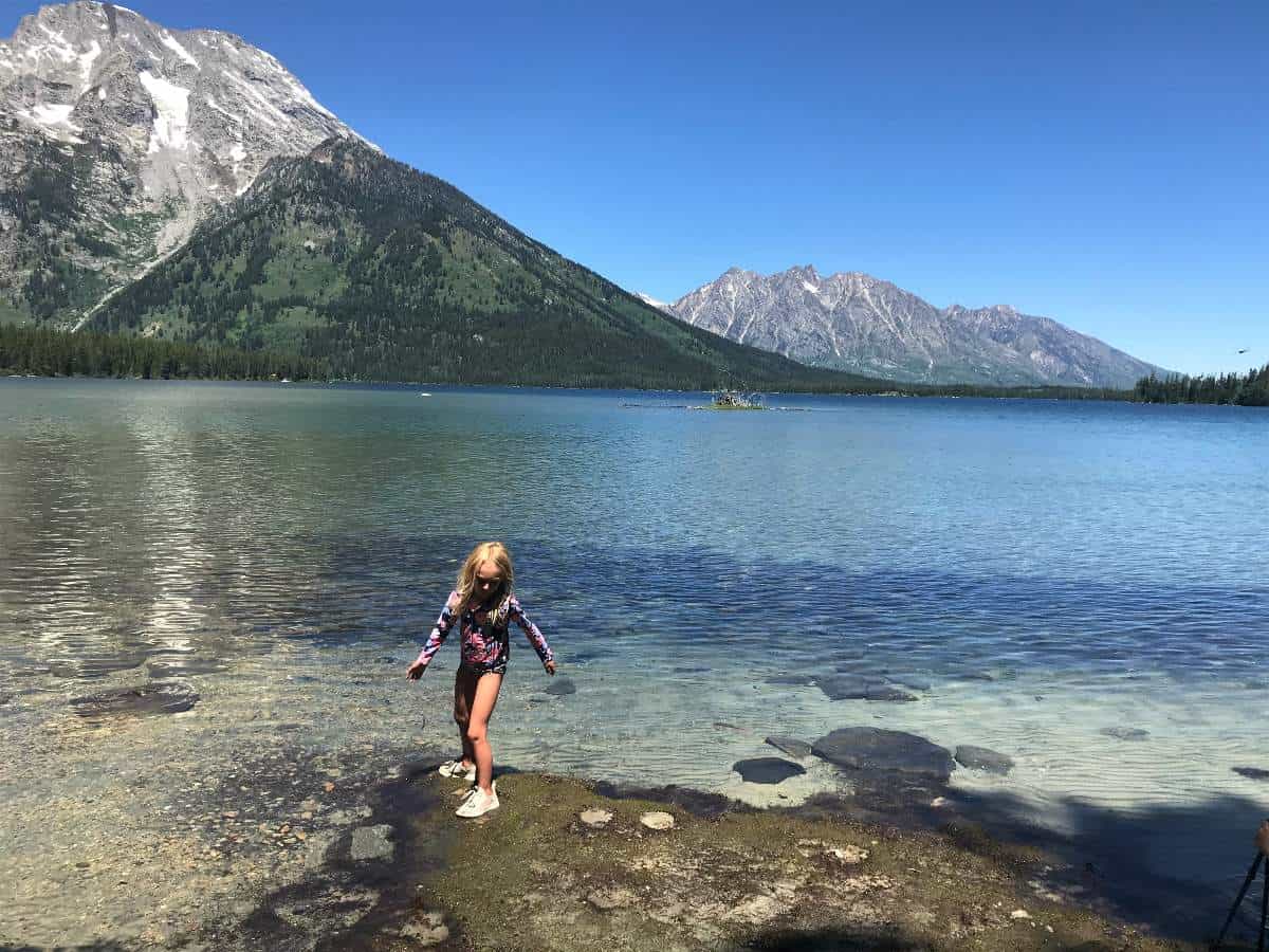 Girl walking in Leigh Lake, Grand Teton National Park