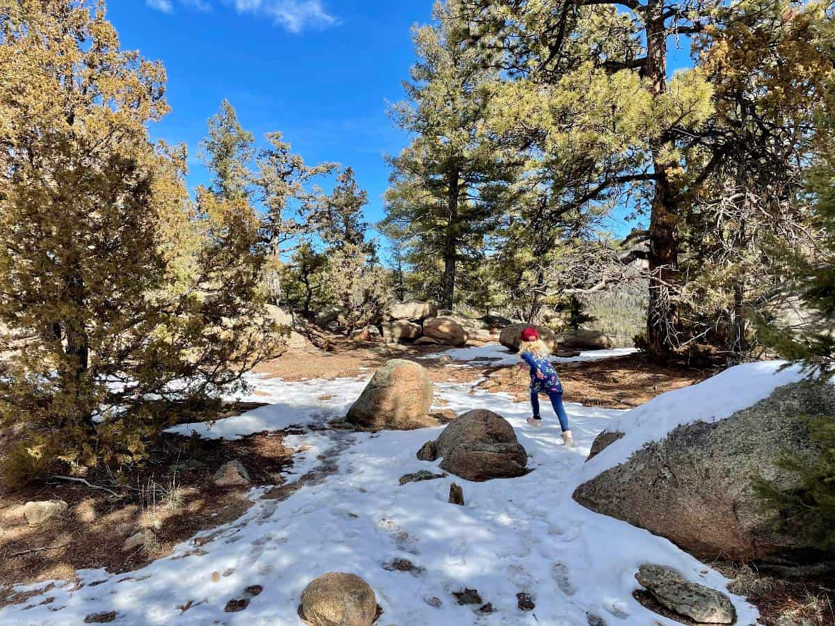 Girl running through rock area