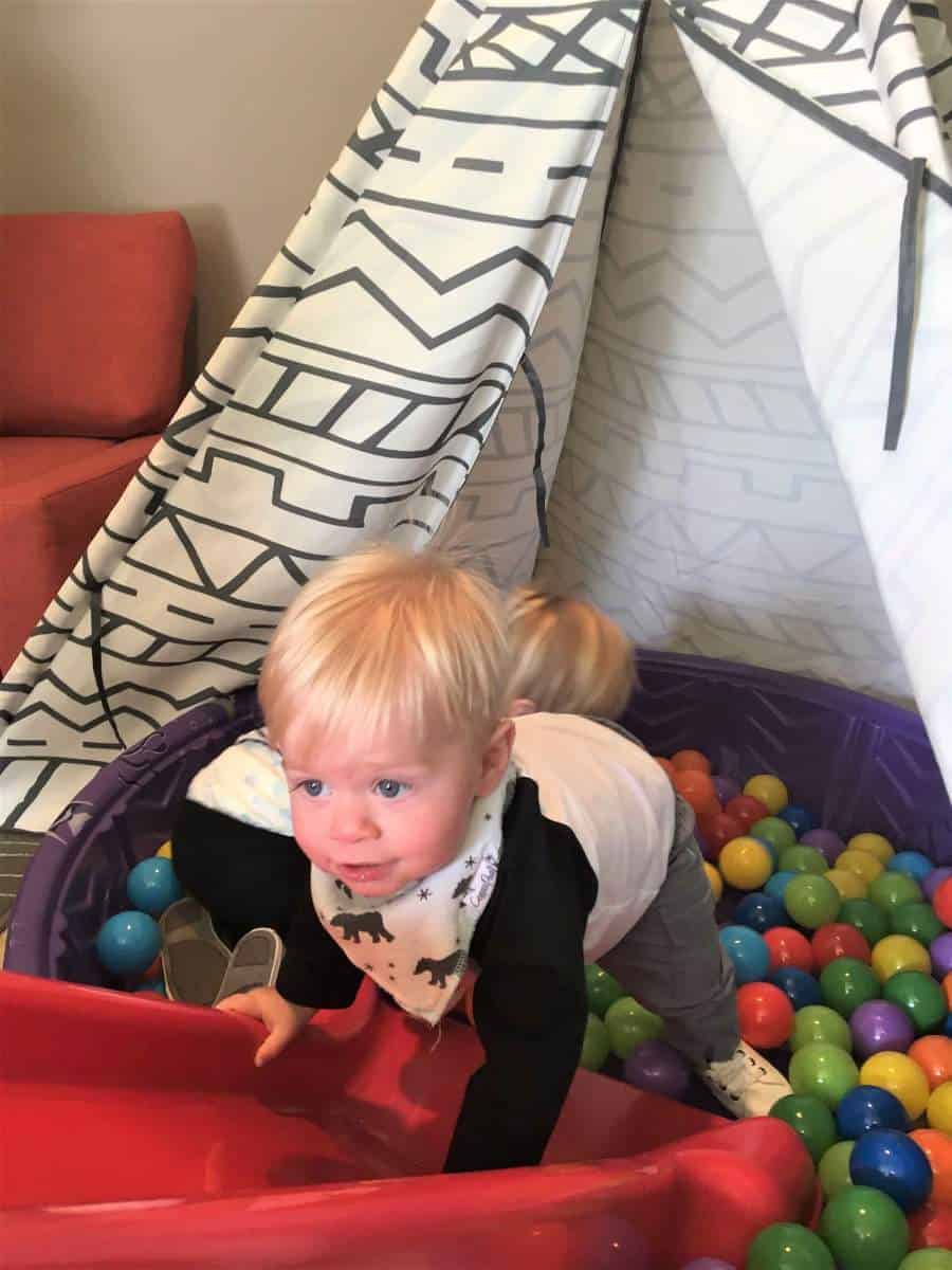 birthday boy playing in the ball pit at his bear birthday
