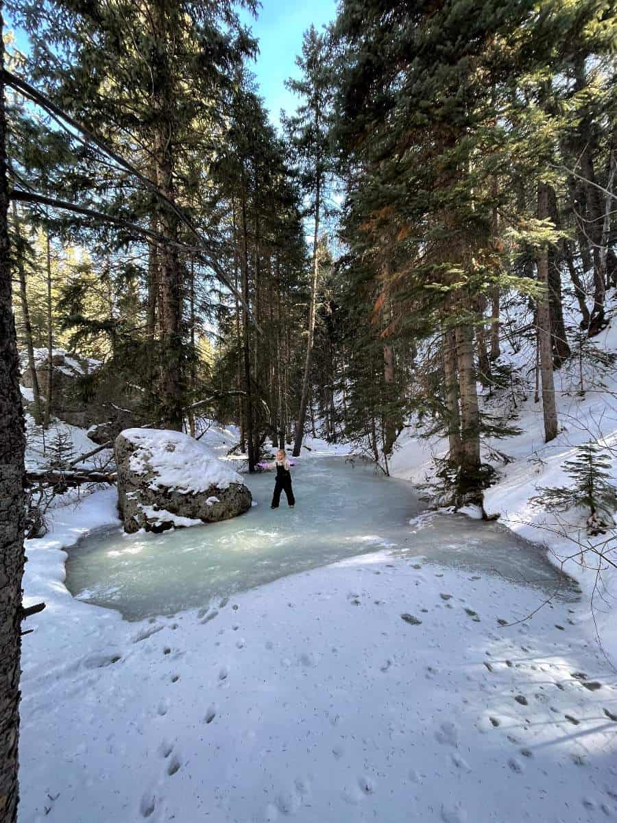 Girl on frozen creek