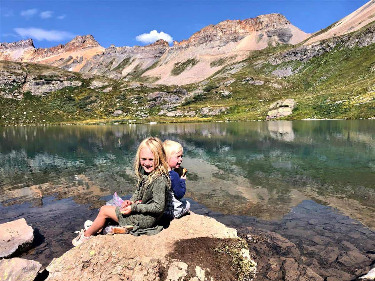 kids in front of lake