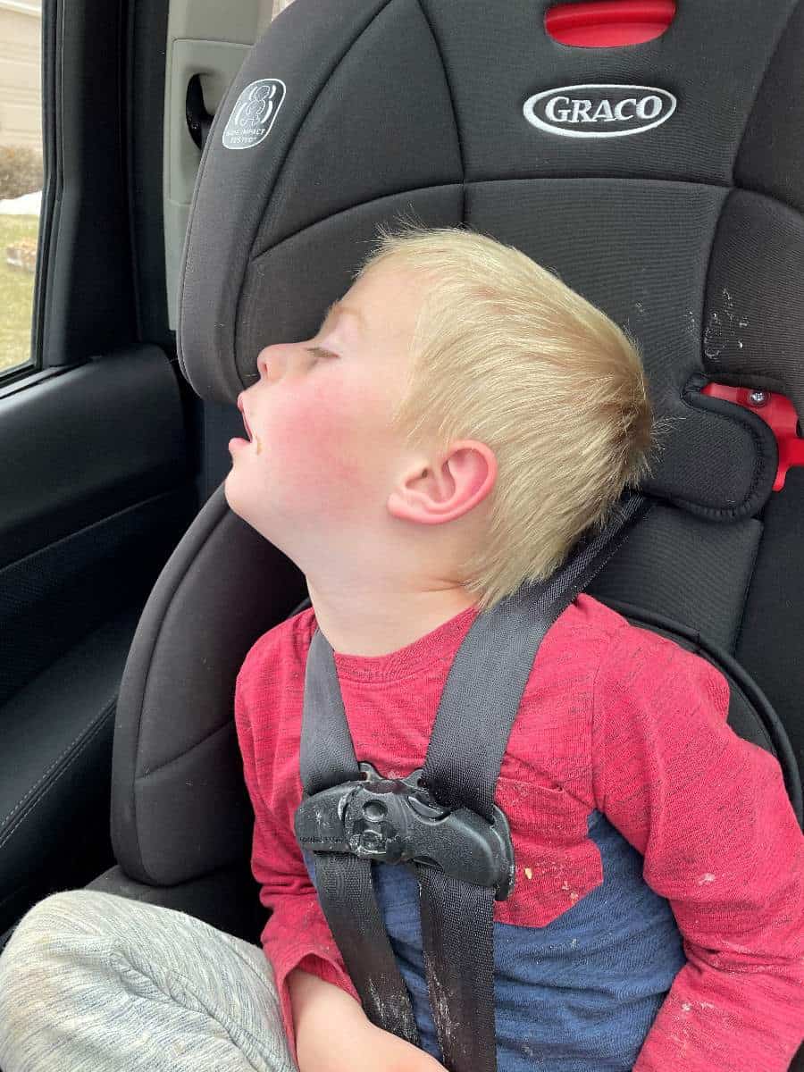Boy sleeping in car after Manitou Incline hike