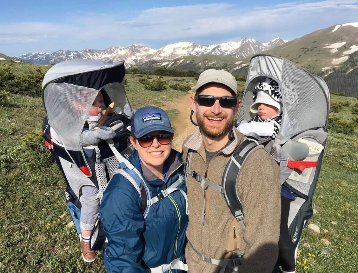 parents carrying kids in Osprey carriers on hike in Rocky Mountain National Park