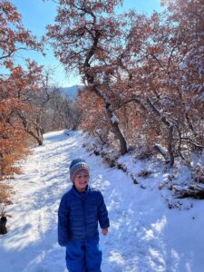 boy hiking in snow