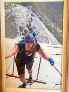 Woman hiking Half Dome cables