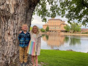 kids in front of tree at The Broadmoor Hotel