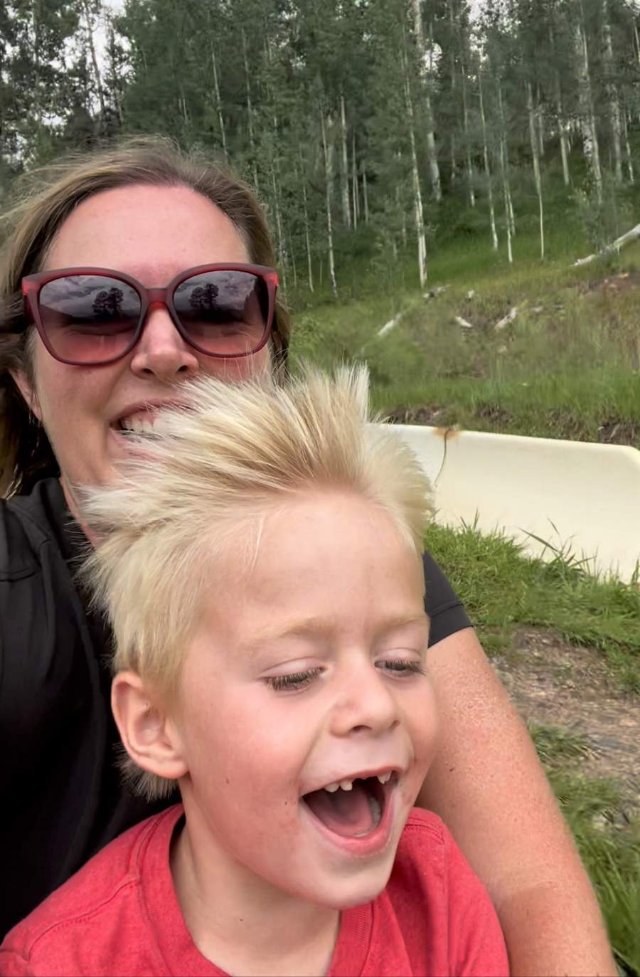 mom and son riding an alpine slide