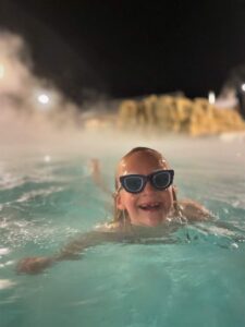 girl swimming in heated outdoor pool at Gaylord Rockies Hotel