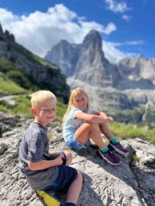 Girl and boy hiking the Dolomites