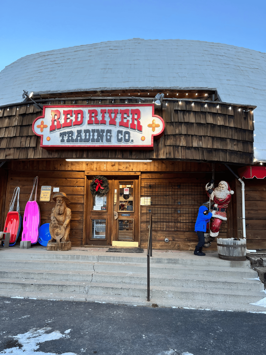 Boy in front of Red River Trading Company
