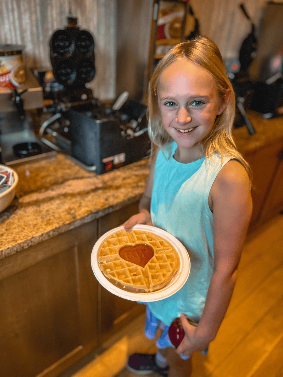 Girl holding Best Western waffle