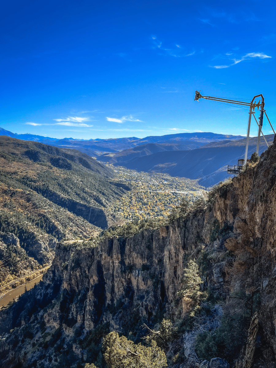 Swing hanging over side of mountain