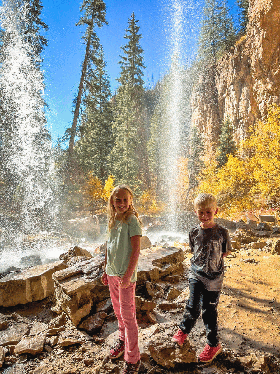 Kids under waterfall at Hanging Falls