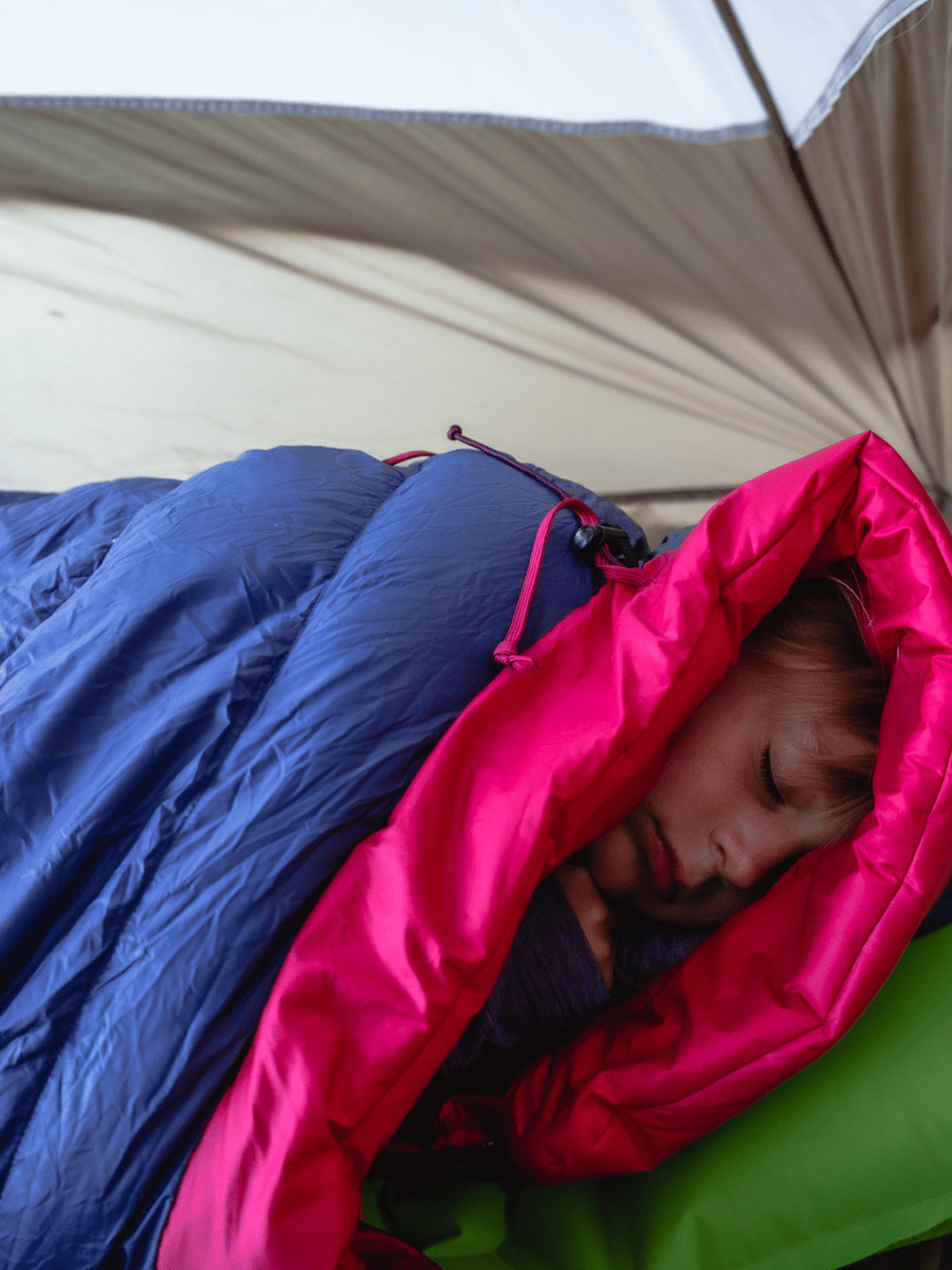 girl sleeping in tent