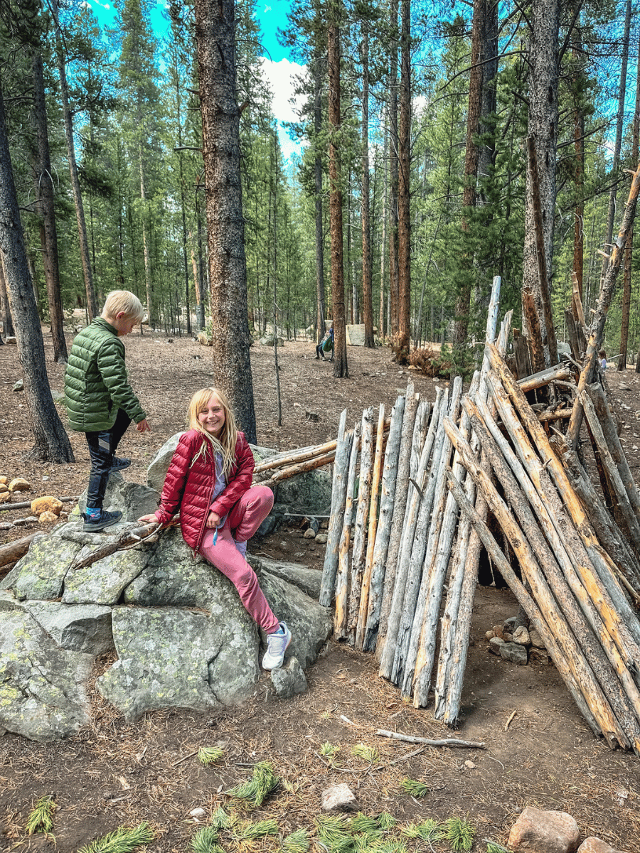 Kids building a fort in the forest