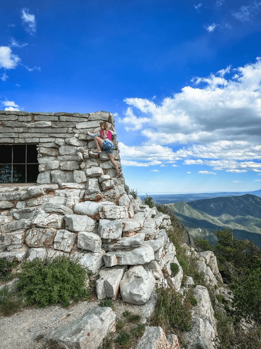 Girl climbing on Kiwanis Cabin